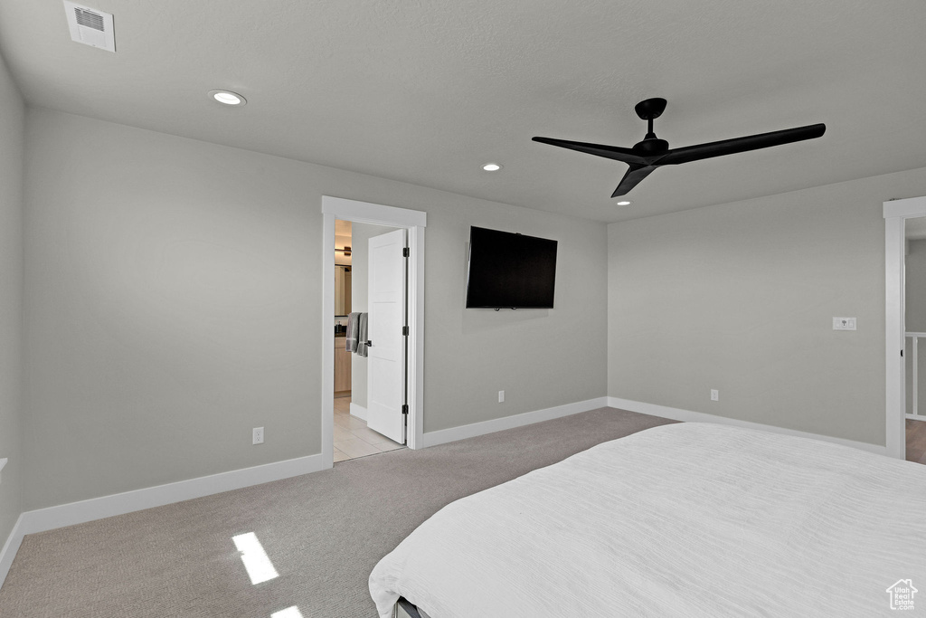 Bedroom featuring light colored carpet, recessed lighting, baseboards, and a ceiling fan