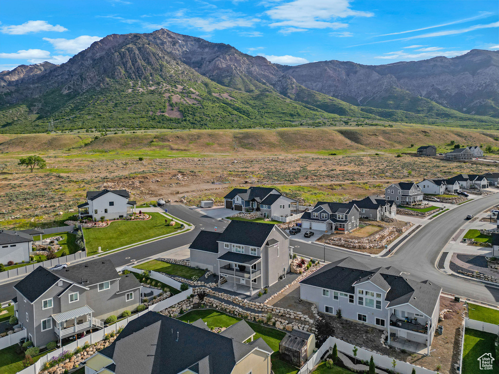 Aerial view of residential area featuring a mountain backdrop