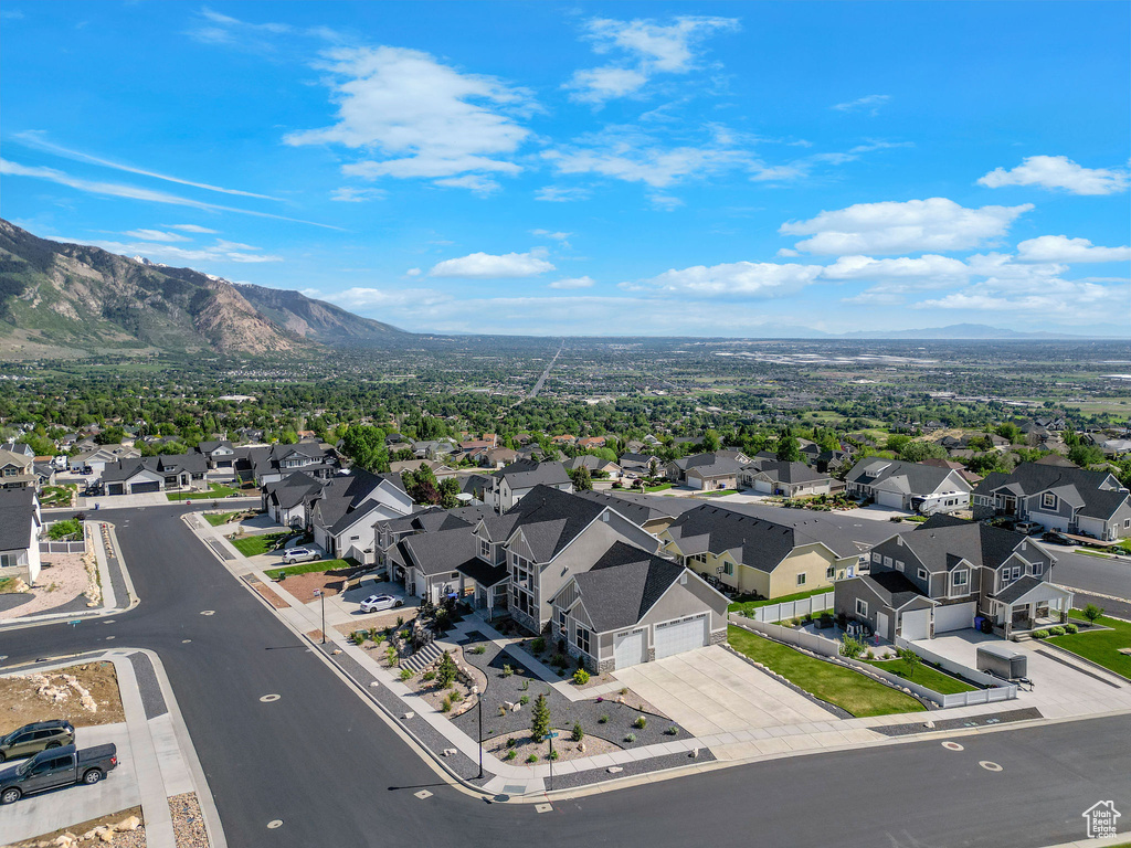 Aerial view of residential area featuring a mountainous background
