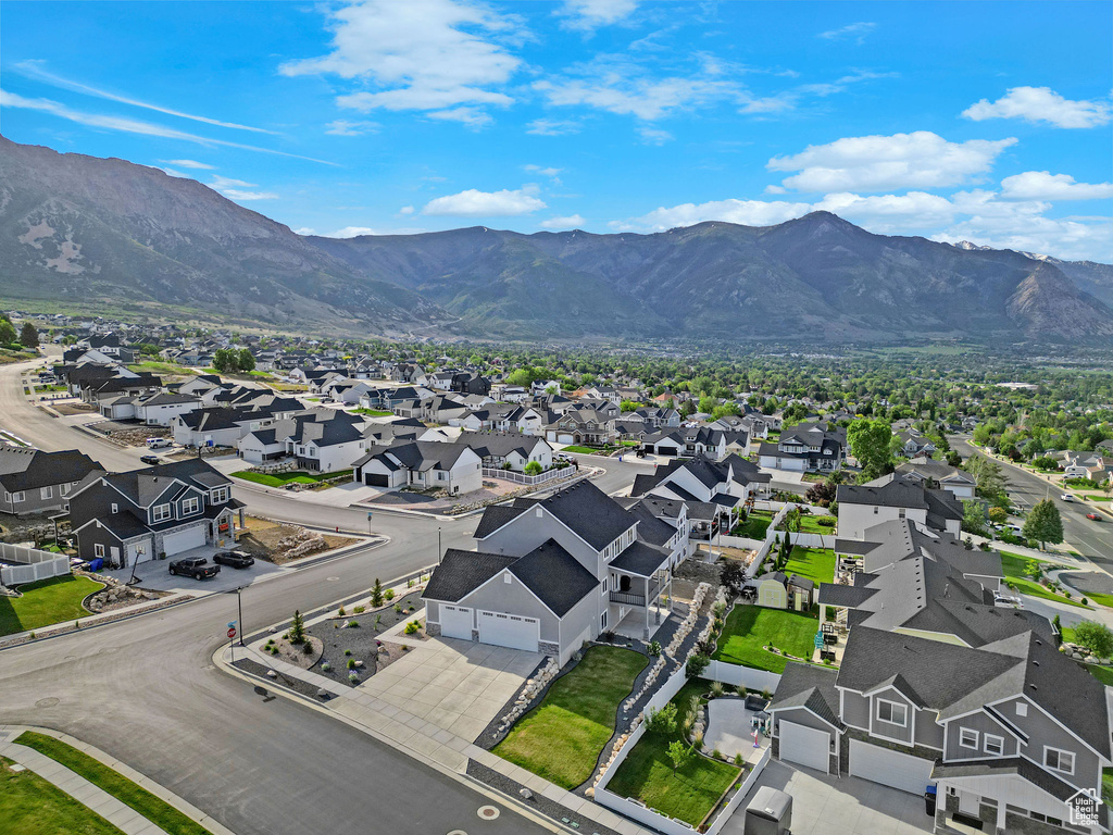 Aerial perspective of suburban area with a mountainous background