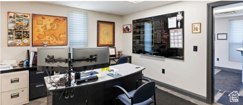 Office space featuring carpet and baseboards