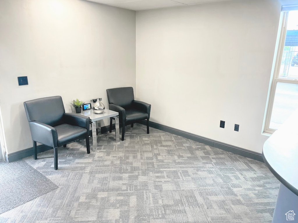 Sitting room with carpet flooring and baseboards