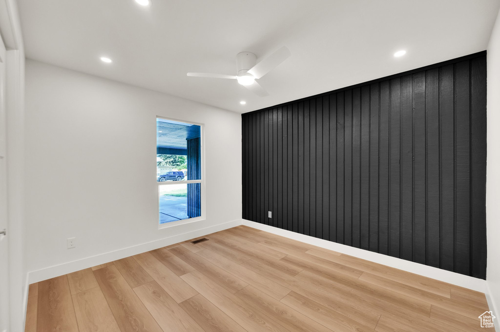 Unfurnished room with light wood finished floors, recessed lighting, ceiling fan, and baseboards