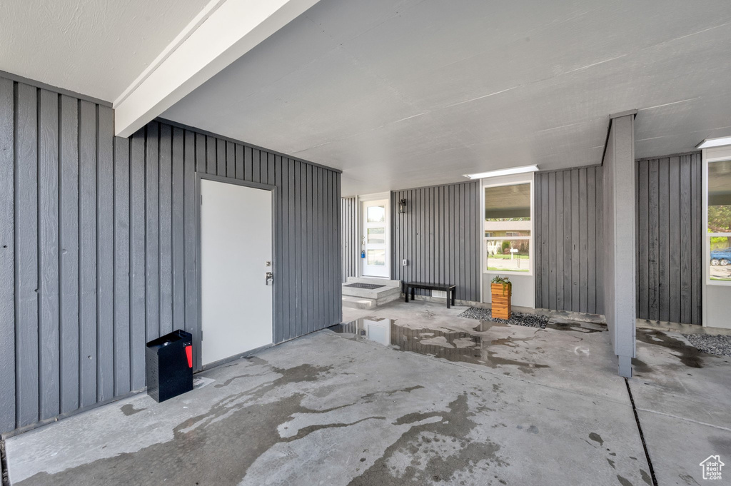 Property entrance featuring board and batten siding