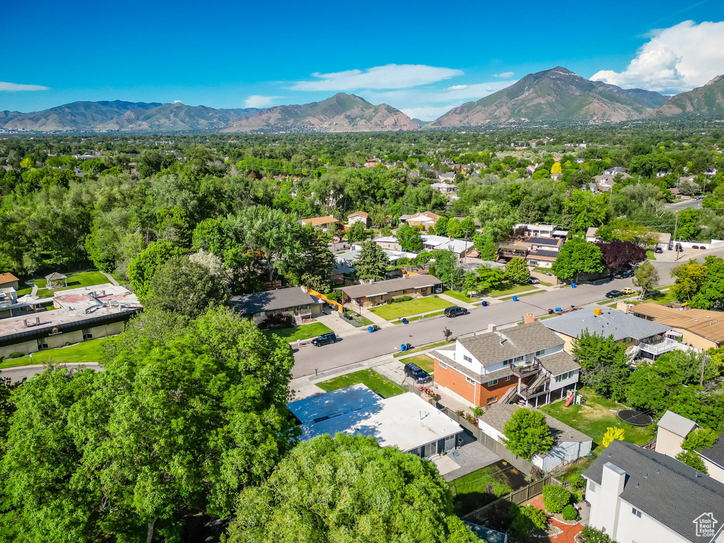 Aerial perspective of suburban area with a mountainous background