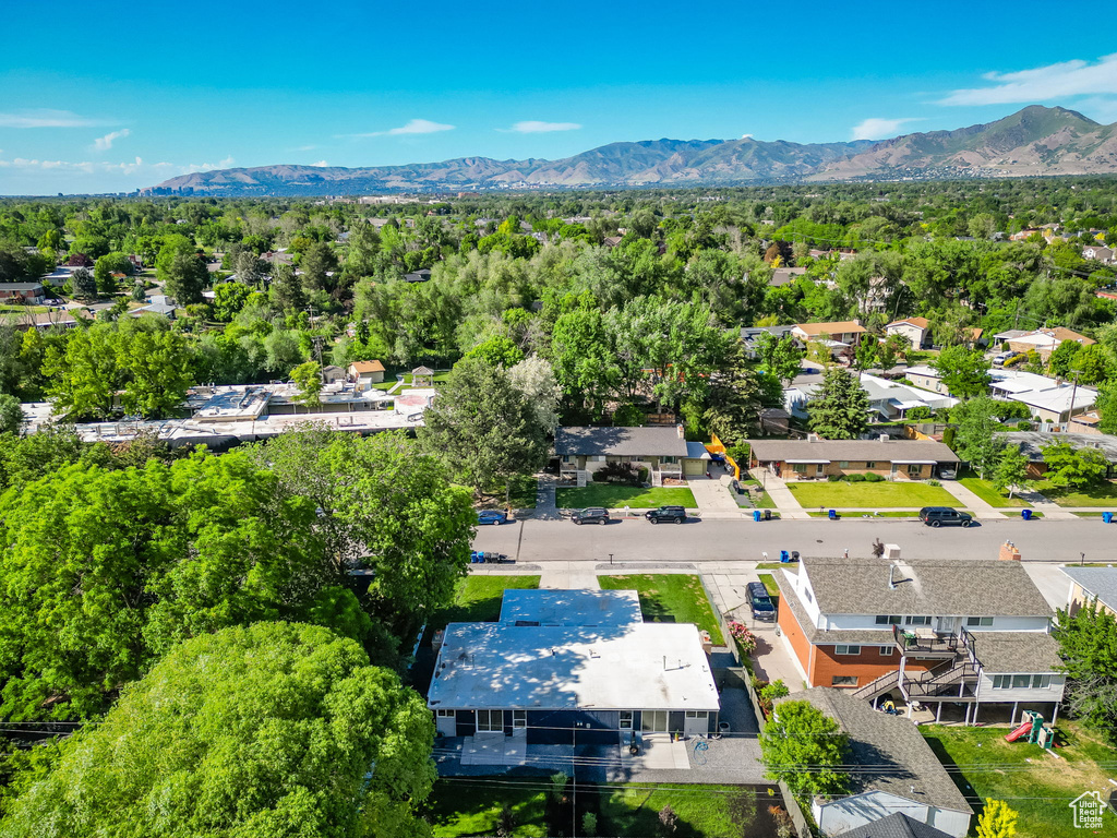 Aerial perspective of suburban area with a mountain backdrop