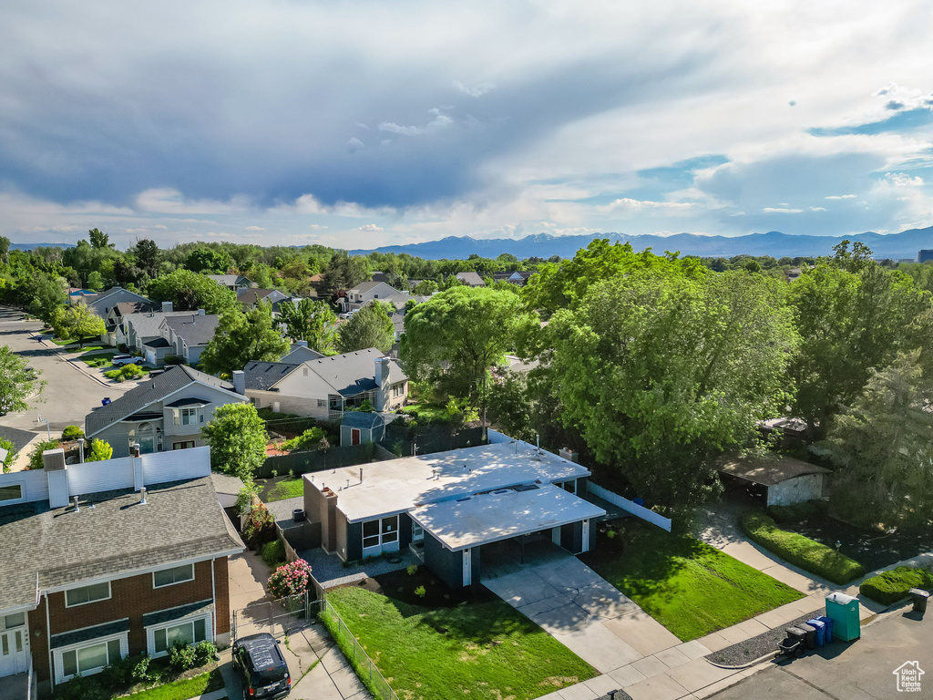 Aerial perspective of suburban area featuring a mountainous background