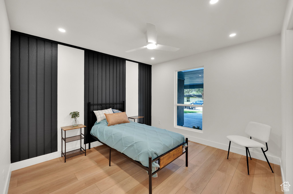 Bedroom featuring light wood-type flooring, recessed lighting, baseboards, and ceiling fan