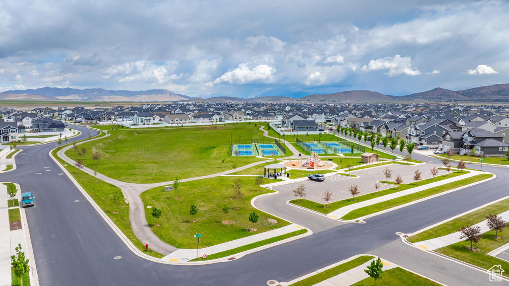 Aerial perspective of suburban area with a mountainous background