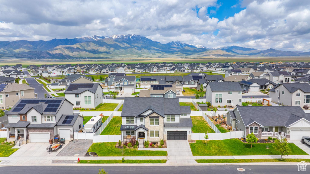Aerial view of residential area featuring a mountain backdrop