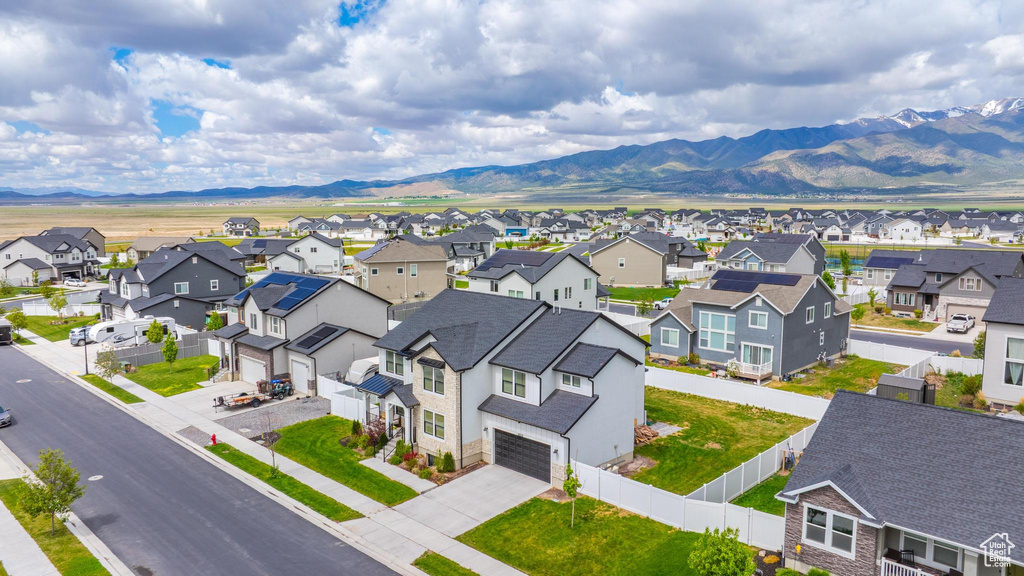 Aerial view of residential area featuring a mountain backdrop