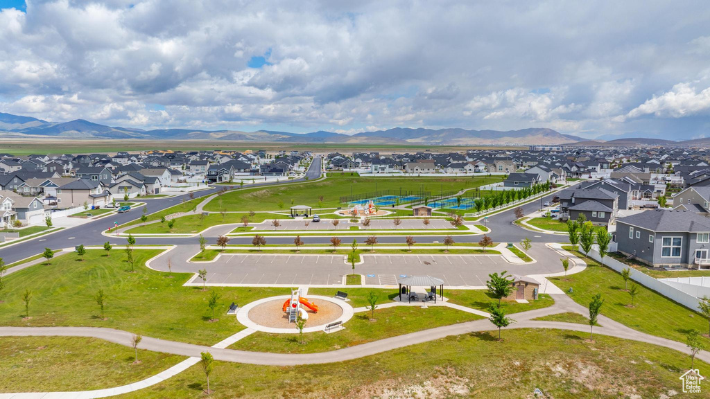 Aerial perspective of suburban area featuring a mountainous background