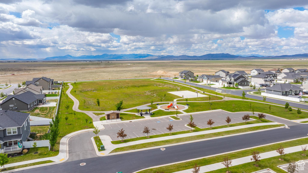 Aerial view of residential area featuring a mountain backdrop
