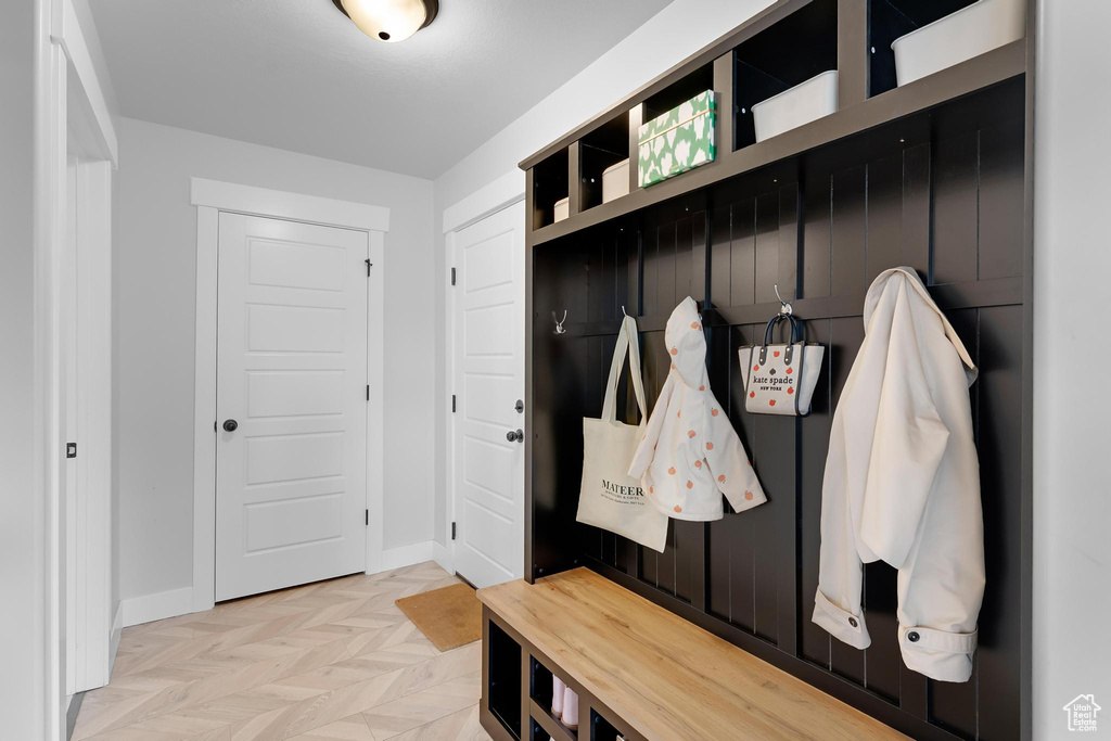 Mudroom featuring baseboards