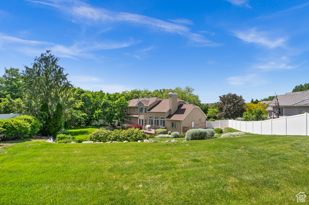 Rear view of property featuring stucco siding