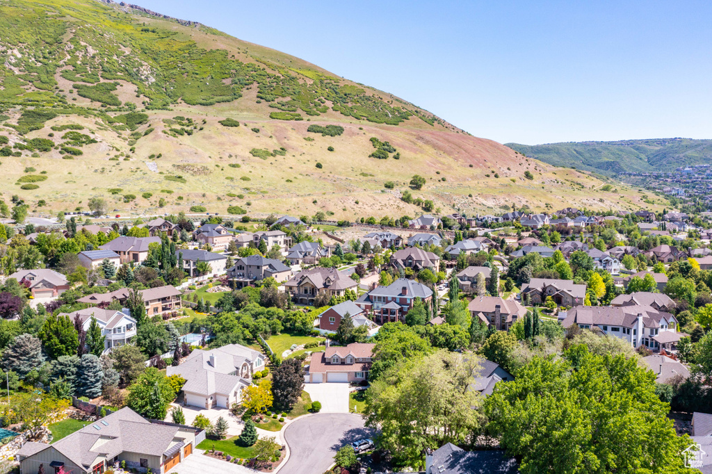 Aerial view of residential area featuring mountains
