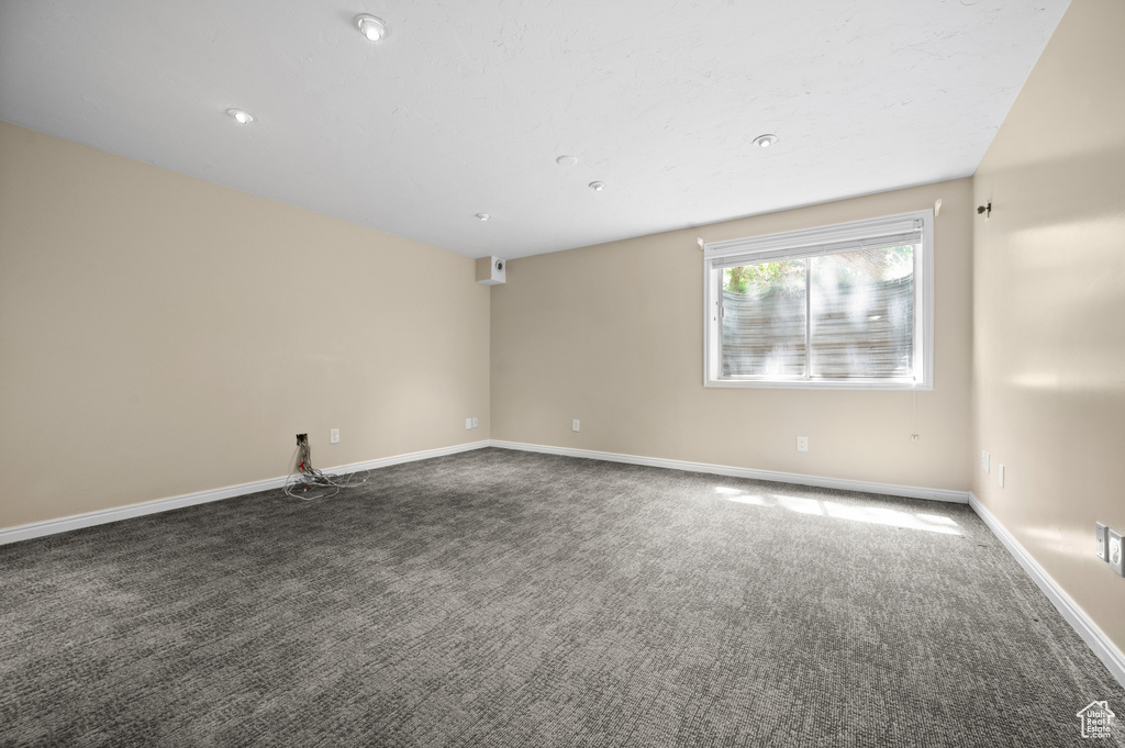 Unfurnished room featuring carpet flooring and baseboards