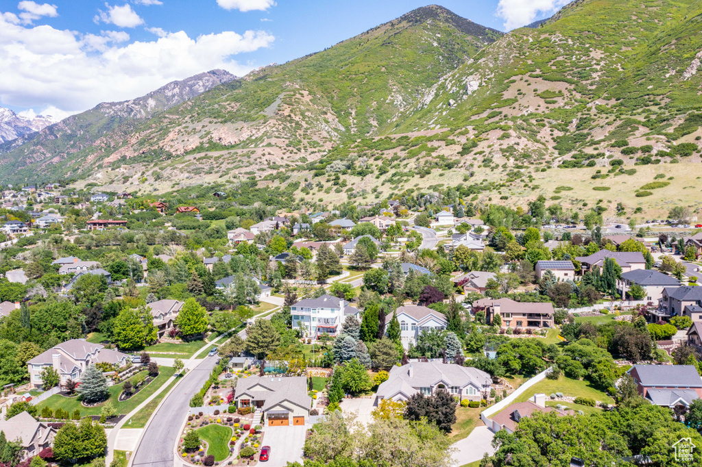 Aerial perspective of suburban area with a mountainous background