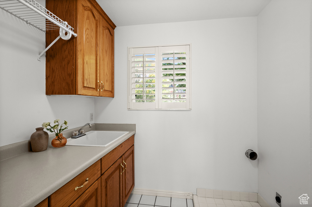 Laundry room with cabinet space, baseboards, and hookup for an electric dryer