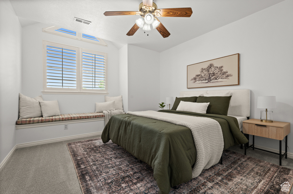 Bedroom featuring carpet flooring, baseboards, and a ceiling fan