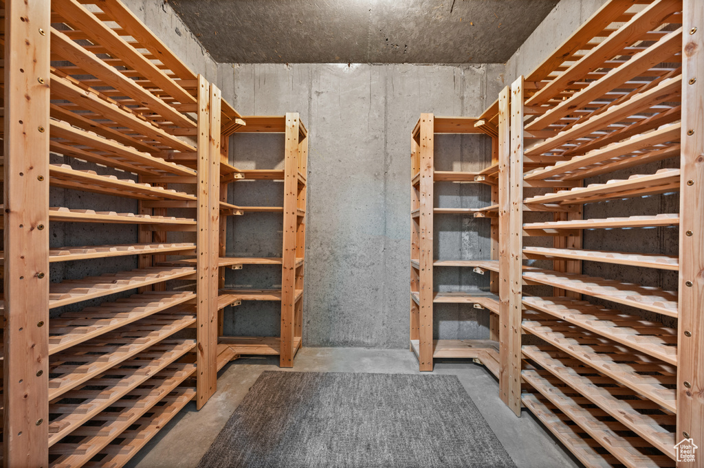 Wine area with unfinished concrete flooring