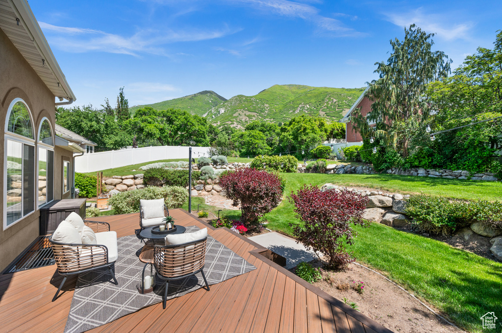 Wooden deck featuring a mountain view