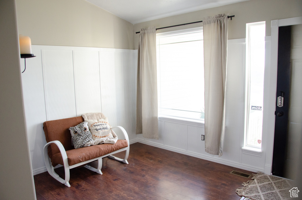 Living area with dark wood-type flooring