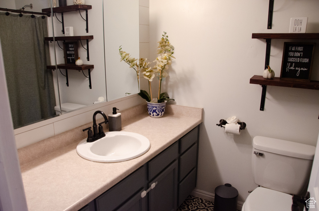 Bathroom with toilet and vanity