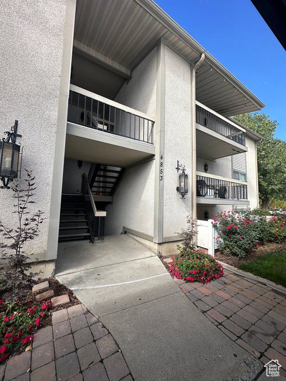 View of property featuring stairway