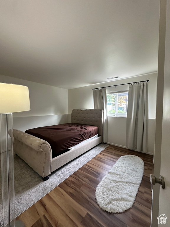 Bedroom featuring wood finished floors