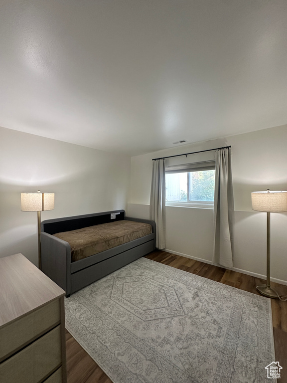 Living area featuring wood finished floors and baseboards