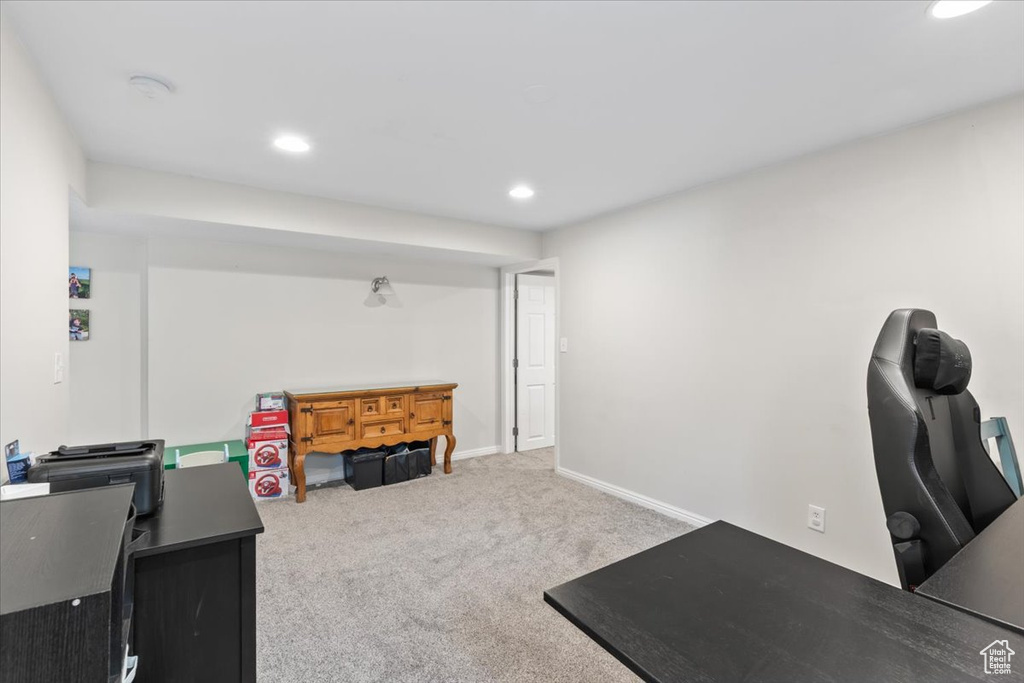 Carpeted home office with recessed lighting and baseboards