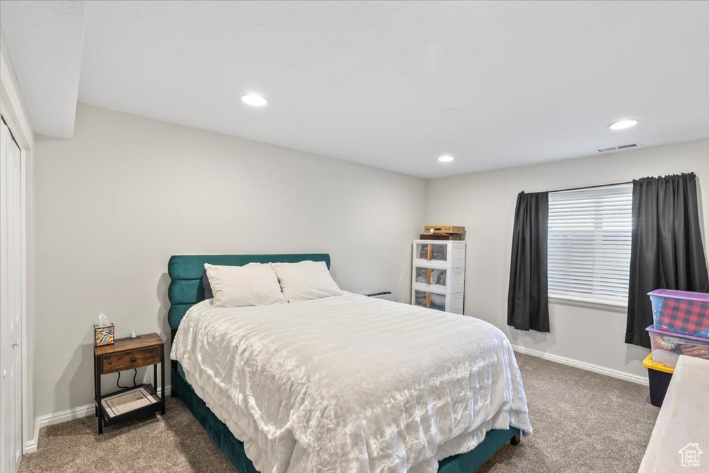 Bedroom featuring carpet floors, recessed lighting, baseboards, and a closet