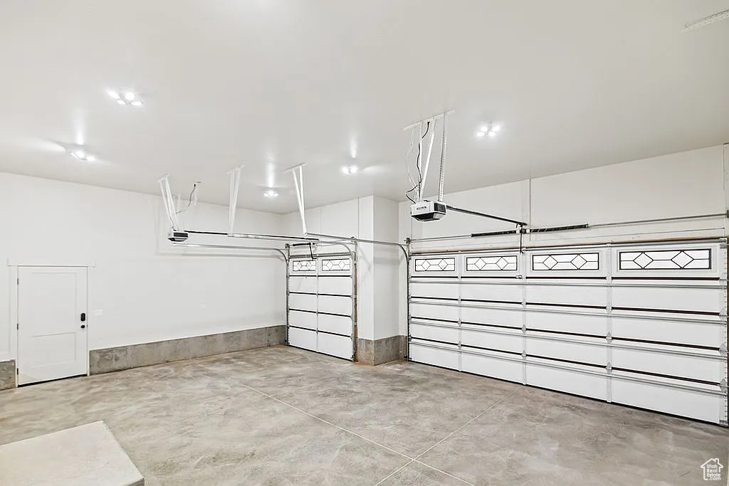 Garage featuring a garage door opener