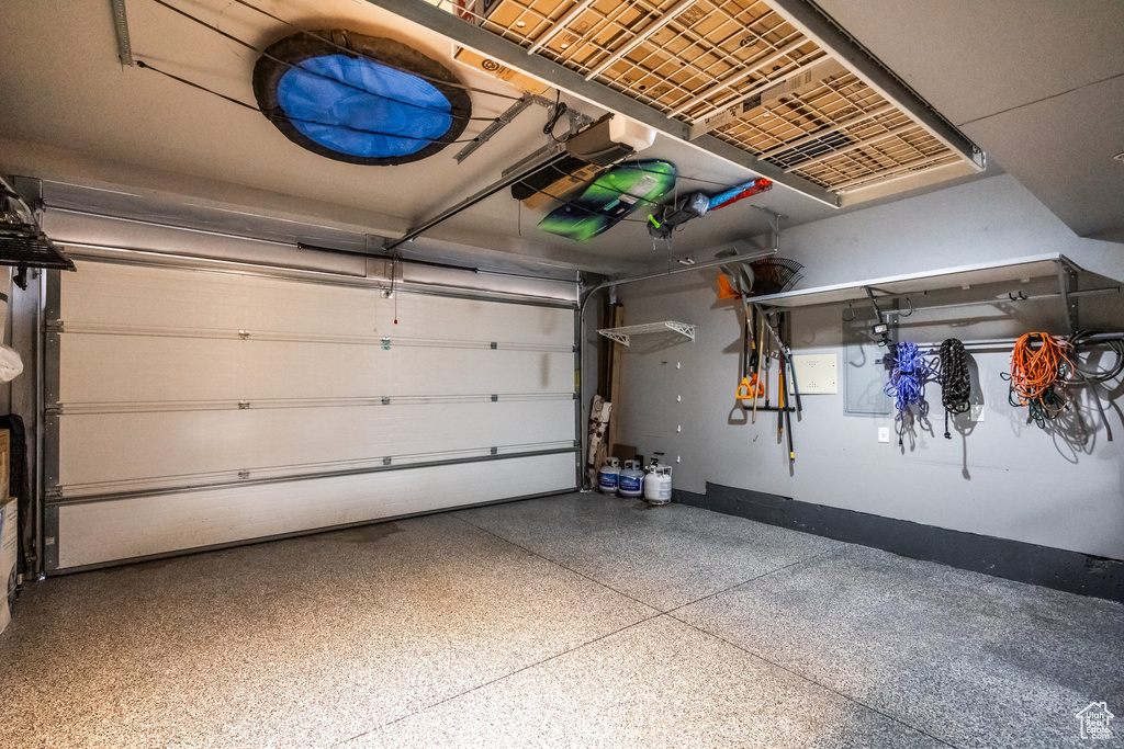 Garage featuring baseboards