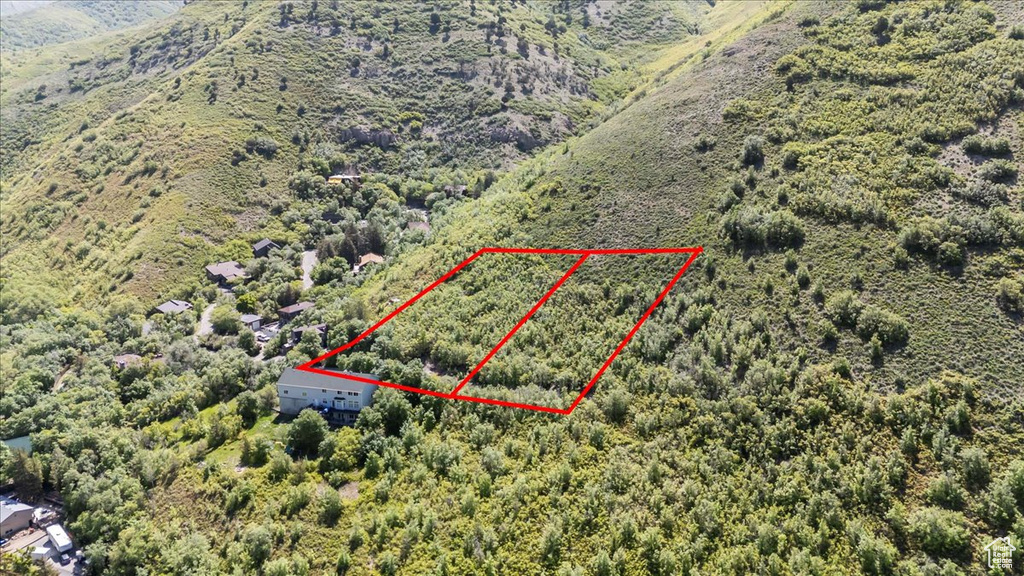 Aerial overview of property\\\'s location featuring property parcel outlined