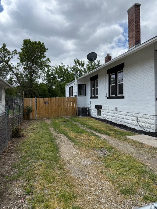 View of yard with cooling unit