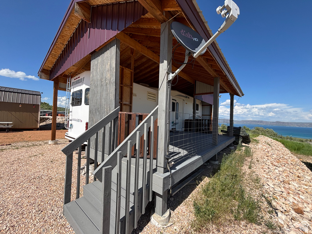 View of side of home featuring a water view