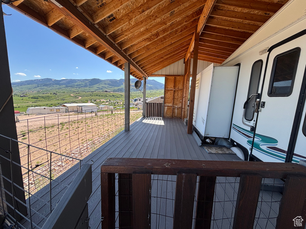 Wooden deck featuring a mountain view