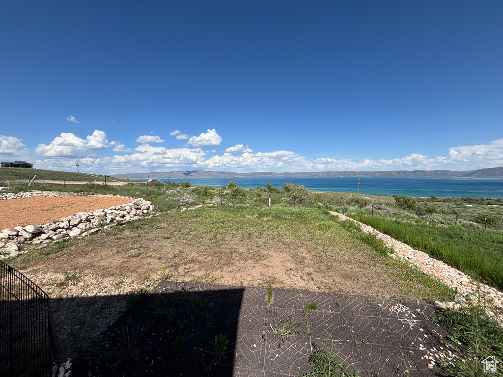 View of yard featuring a water and mountain view