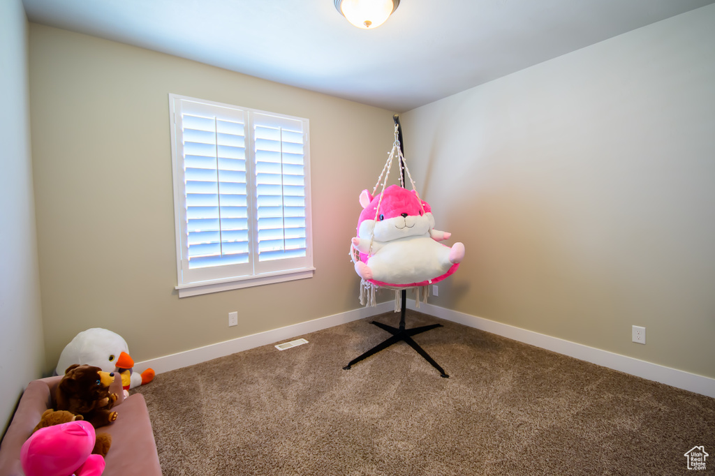 Playroom with carpet floors and baseboards