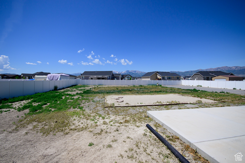 View of yard featuring a residential view and a mountain view