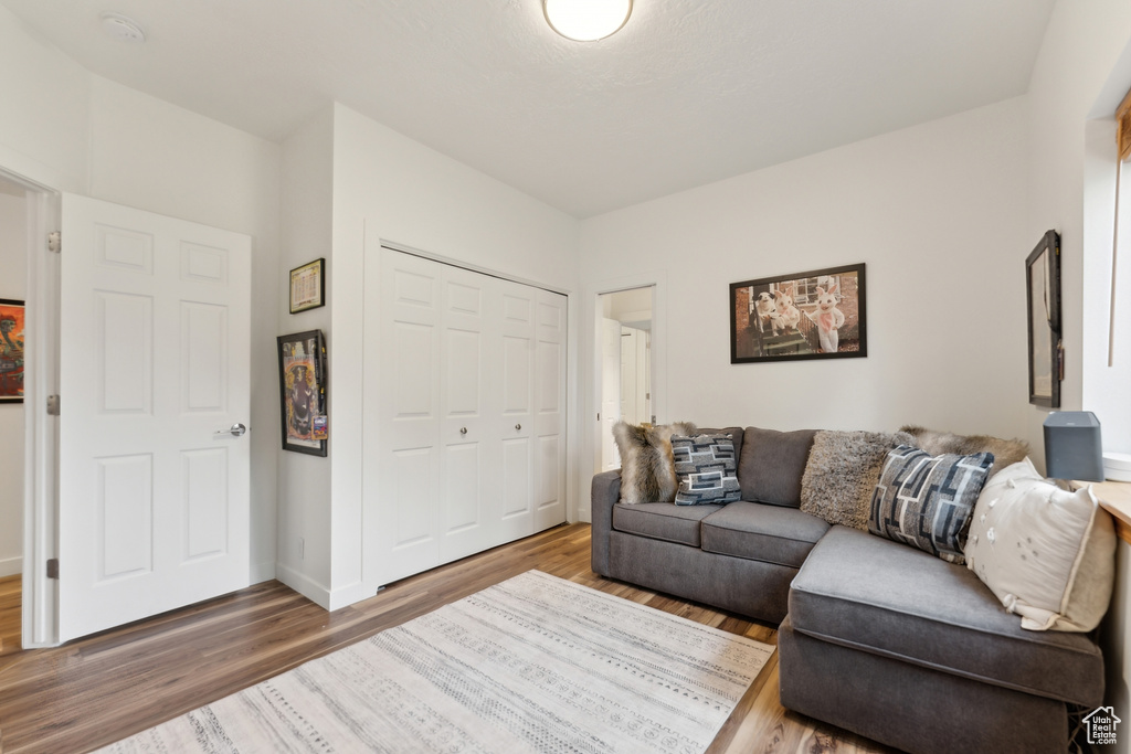 Living area featuring wood finished floors and baseboards
