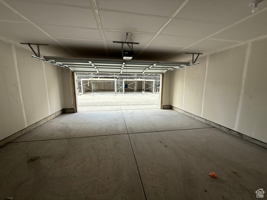 Garage featuring a garage door opener