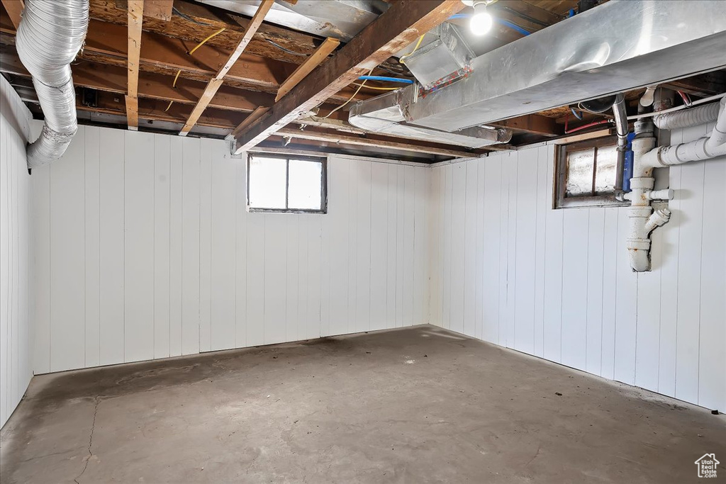 Below grade area featuring wooden walls