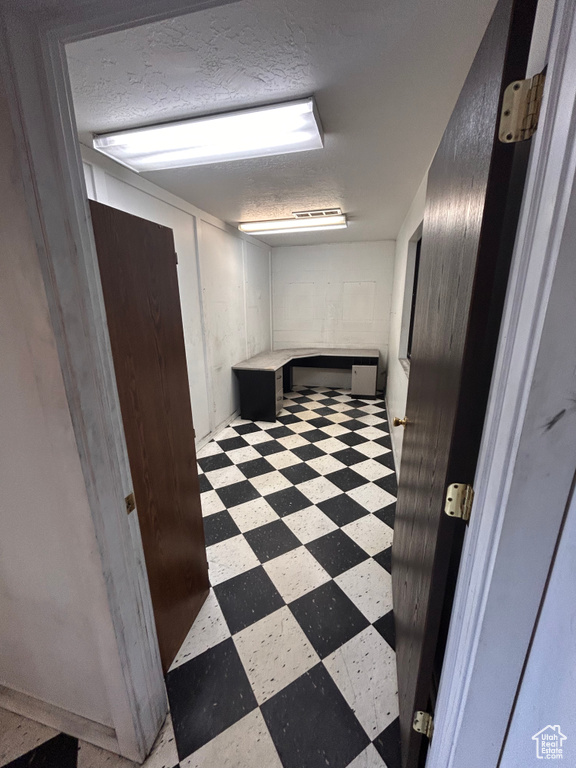 Hall with tile patterned floors