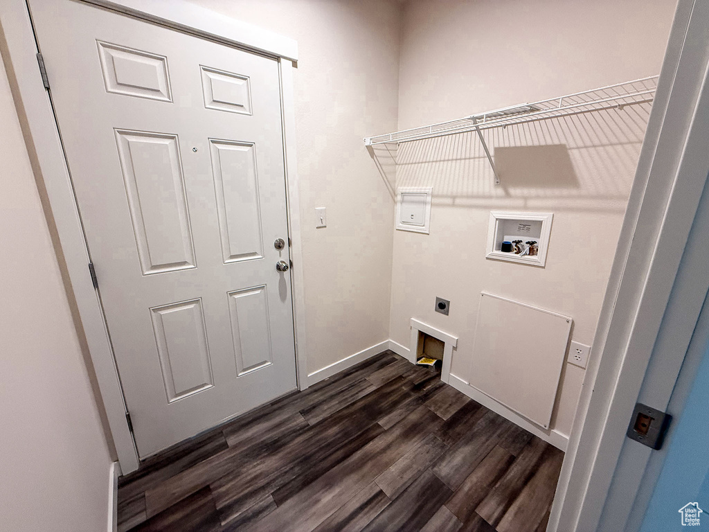Laundry room with electric dryer hookup, dark wood-style floors, hookup for a washing machine, and baseboards