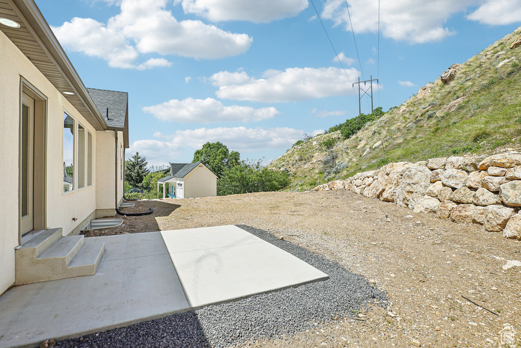 View of patio / terrace featuring an outbuilding