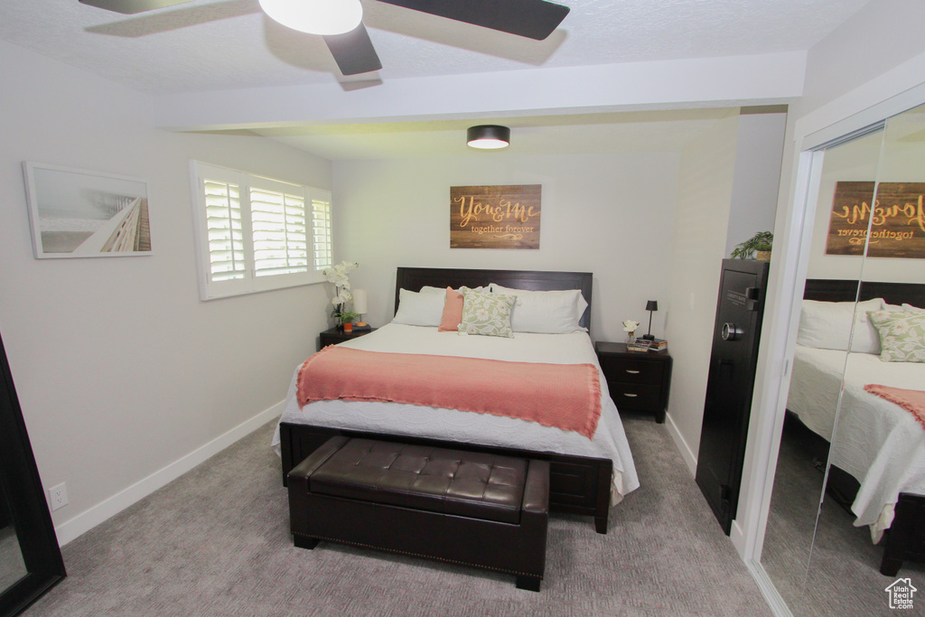 Bedroom featuring carpet flooring, baseboards, a closet, and a ceiling fan