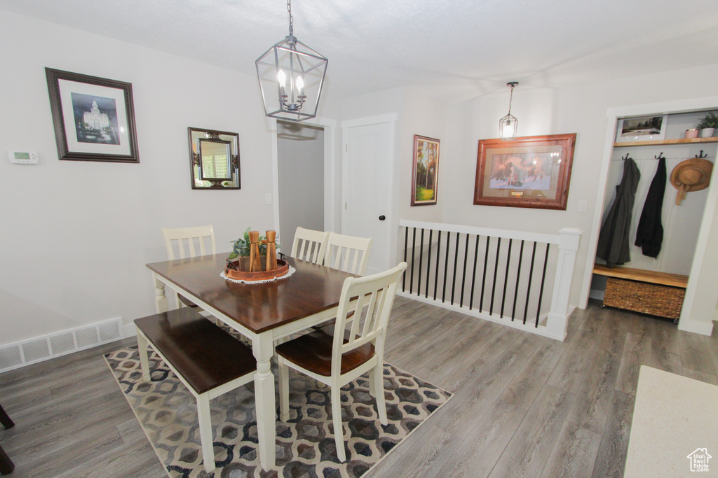 Dining room featuring a chandelier and wood finished floors